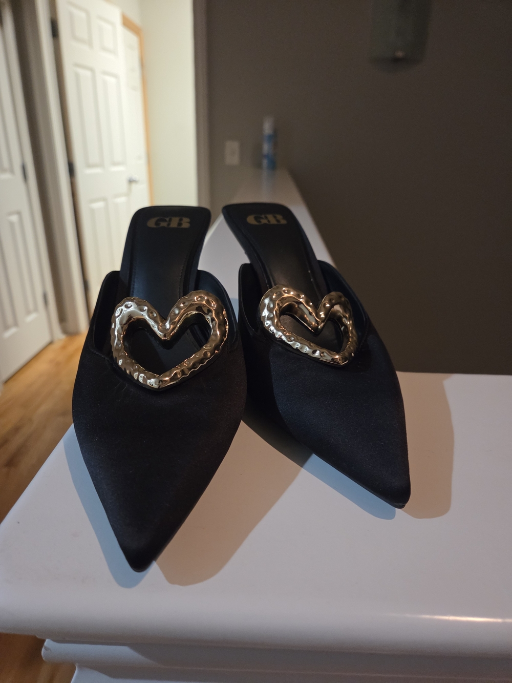 Gianni Bini Black Satin Pointed Mules with Gold Heart Detail